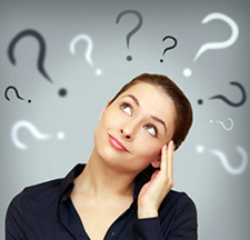 Woman in black V-neck shirt, her hand on her head, looking at the top left corner of the photo with black and white question marks around her. = https://www.quincymutual.com/index.htm